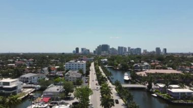 Fort Lauderdale Cityscape, Florida USA. Aerial View, Boating Canals and Downtown Buildings in Skyline, Las Olas Boulevard Traffic, Drone Shot 4k