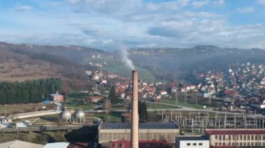 Aerial View of Dangerous Smoke From Metallurgical Factory, Electricity Facility and Small Valley Town in Western Serbia, Drone Shot