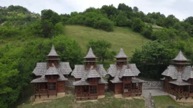 Mokra Gora, Serbia. Drone Aerial View of Wooden Houses Above Jatare Narrow Gauge Railway Station, Sargan Eight 4k