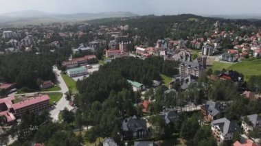 Zlatibor Mountain Drone Aerial View, Resort Town in Western Serbia on Summer Day Hotels, Houses, Apartment Buildings, Church, Establishing Shot 4k