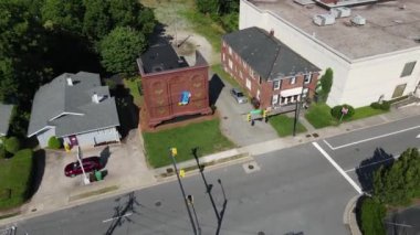 Aerial View of Worlds Largest Chest of Drawers, Landmark Building of High Point City, North Carolina USA on Sunny Summer Day, 60fps Drone Shot