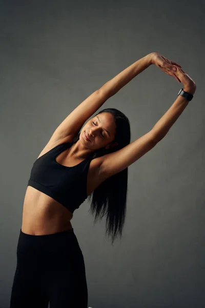 Young Biracial Woman Sports Clothing Fitness Tracker Arms Raised Stretch — 图库照片