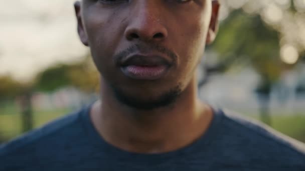 Close Young Black Man Looking Camera While Inhaling Exhaling Break — Stockvideo