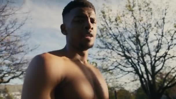 Shirtless Young Black Man Exhaling While Taking Break Flexing Muscles — Stockvideo