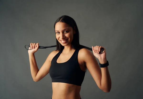 Portrait Happy Young Biracial Woman Wearing Sports Bra Holding Jump — 图库照片