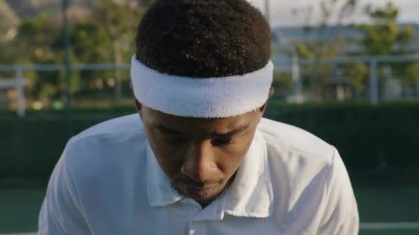 Portrait Young Black Man Wearing Headband Tennis Racquet While Playing — Stock Video