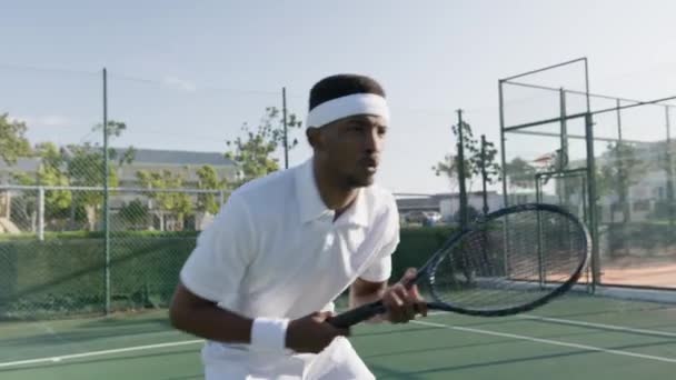 Athletic Young Black Man Wearing Sportswear Hitting Ball Tennis Racquet — Stock videók