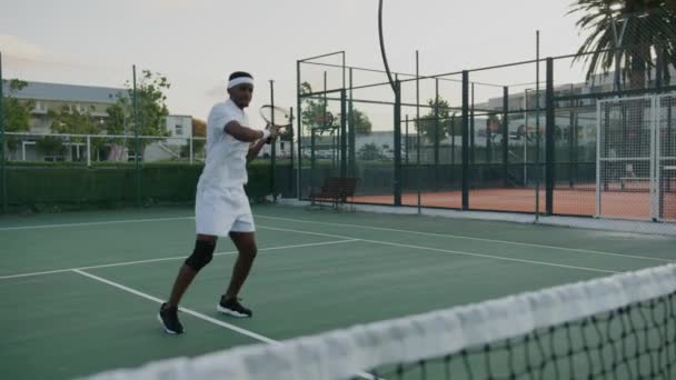 Athletic Young Black Man Wearing Sports Clothing Hitting Ball Tennis — Video Stock