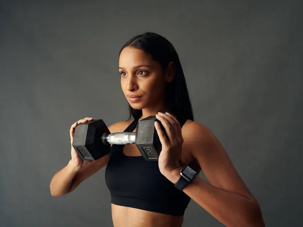 Young Biracial Woman Wearing Sports Bra Looking Away While Holding — Stock Photo, Image