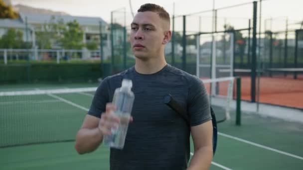 Young Biracial Man Sports Clothing Taking Break Drinking Water Tennis — Stock video
