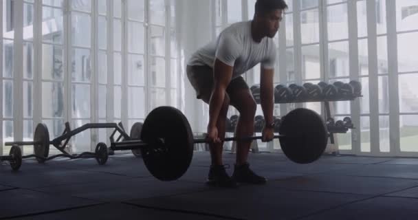 Young Multiracial Man Wearing Sportswear Taking Break Weightlifting Barbell Gym — Stock Video