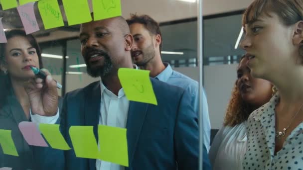 Group Multiracial Colleagues Talking While Using Adhesive Notes Meeting Office — Stock Video