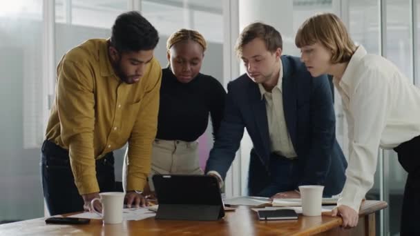 Four Young Multiracial Business People Wearing Businesswear Using Digital Tablet — Stock Video
