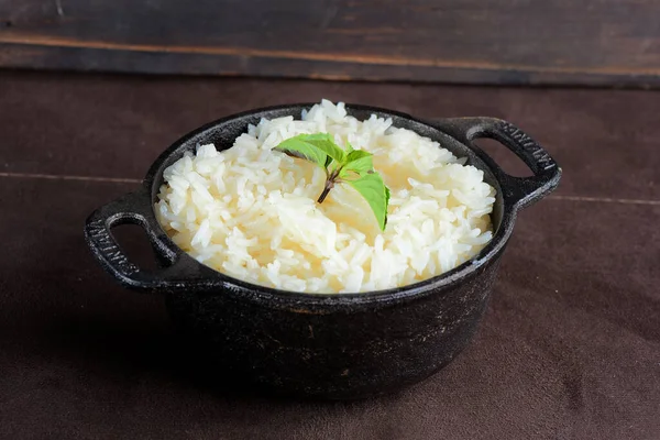 delicious pot of cooked white rice, served in the iron pot typical brazilian food with rice