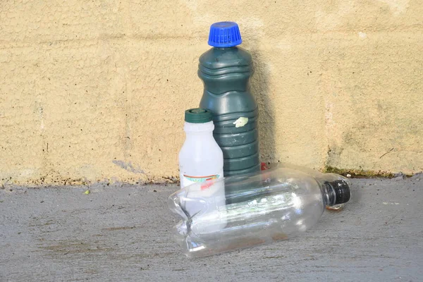 abandoned bottle container with stagnant water inside, a place of proliferation of aedes aegypti larvae, dengue, chikungunya, zika virus contaminated water epidemic mosquito breeding