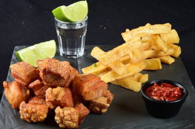 panceta fried pork skin crackling crackling with fries, typical Brazilian food