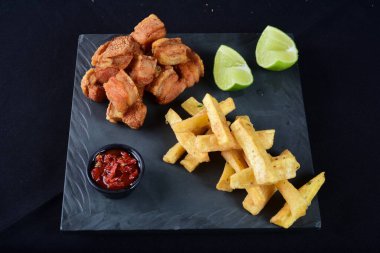 panceta fried pork skin crackling crackling with fries, typical Brazilian food