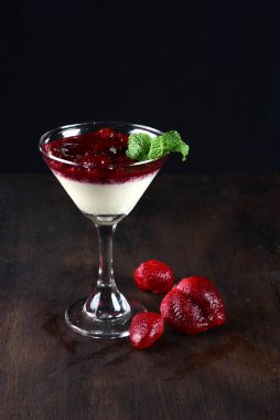 bowl with dulce de leche with red fruit syrup