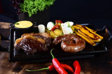 roast beef barbecue pork sausage cassava and potatoes au gratin