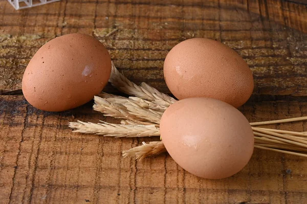 natural chicken egg on the wooden table, rustic free-range chicken natural farm food