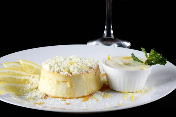 Delicious condensed milk and coconut pudding on a white plate - Coconut pudding with eggs sprinkled with powdered milk