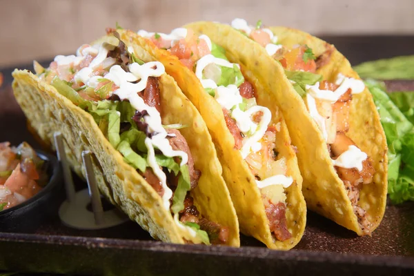 stock image Mexican food tacos, fried chicken, greens, mango, avocado, pepper, red cabbage in tex-mex mix tortillas