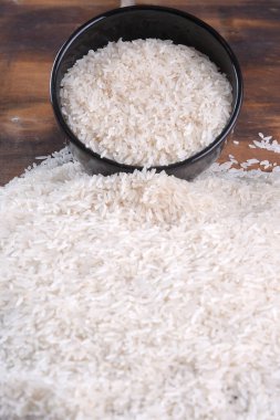 white rice natural long rice grain uncooked healthy food wooden table use texture background clipart