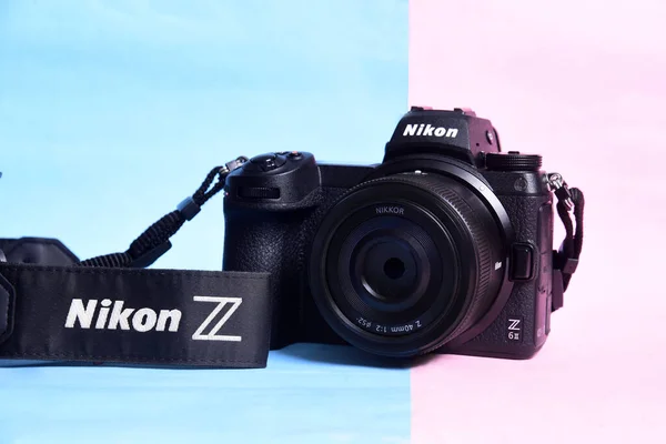 stock image Nikon Z6 II version 2 camera photograph confrontation and competition between cameras. color background. The best mirrorless cameras from top brands.