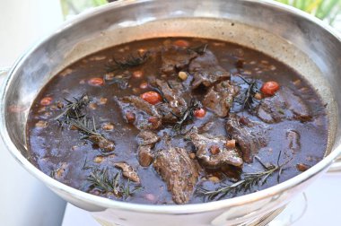 meat cooked in seasoned wood sauce and tasty typical food