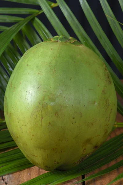 green coconut from Bahia natural coconut juice tropical fruit in half fruit with water tasty organic saudadel plant on a white background