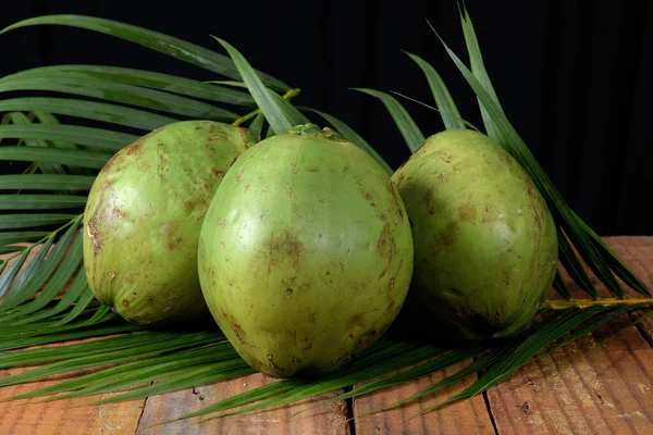 green coconut from Bahia natural coconut juice tropical fruit in half fruit with water tasty organic saudadel plant on a white background