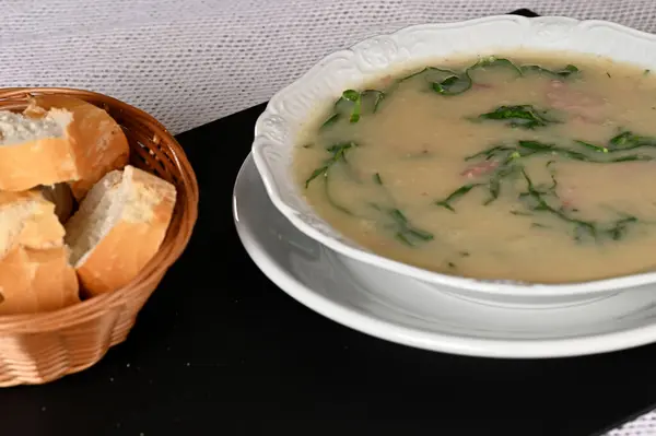 green soup, herbal cream with cassava vegan food natural healthy food with wine in the background food