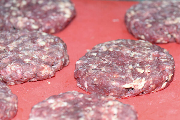 raw hamburger meat minced meat with rosemary ready to bake image