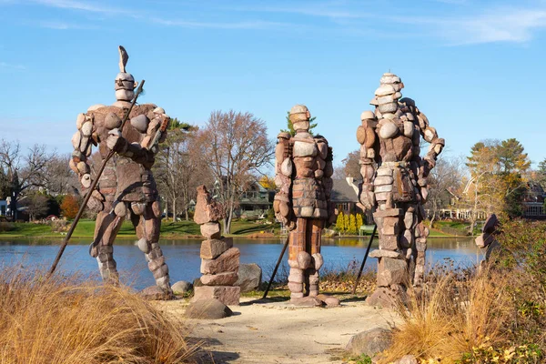 stock image Rockford, Illinois - United States - November 7th, 2022: The Rock Guardians of Rockford sculptures by artist Terese Agnew on the Rock River in Rockford, Illinois, USA.