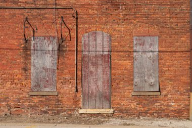 Old weathered brick wall on a sunny morning.