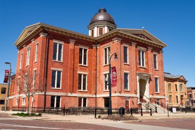 Woodstock, Illinois - United States - April 8th, 2024: Exterior of the historical Old McHenry County Courthouse, built in 1857, in Woodstock, Illinois, USA. clipart