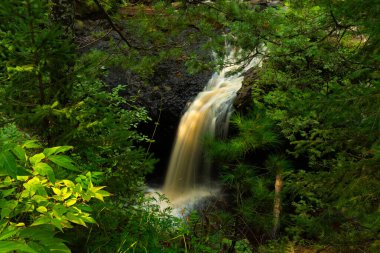 Flowing Snake Pit Falls waterfall at Amnicon Falls State Park in Wisconsin, USA. clipart