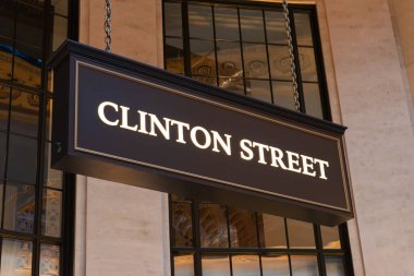 Clinton Street Signage at Union Station in Chicago, Illinois, USA. clipart