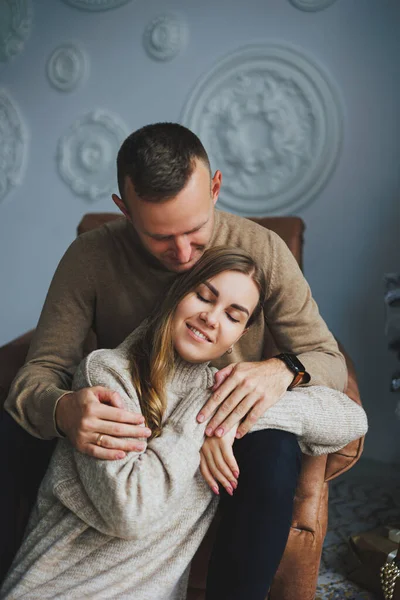 stock image A beautiful couple embraces during a New Year's photo session. Lovers welcome the new year together. A couple in love enjoying each other on New Year's Eve. New Year and Christmas. February 14th.