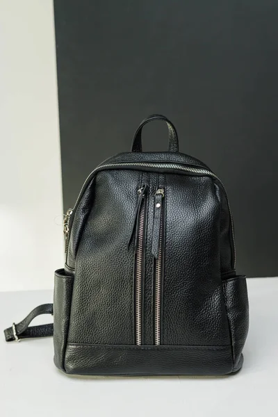 Black women's casual eco-leather backpack close-up. Women's leather bag