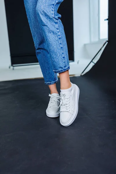 Close Female Legs Jeans Casual White Sneakers Women Comfortable Casual — Foto de Stock