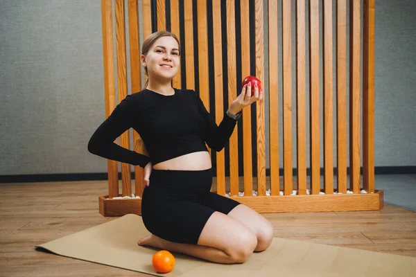 stock image Young beautiful pregnant woman in sportswear uniform top, leggings. Healthy nutrition for pregnant women. Balanced nutrition.