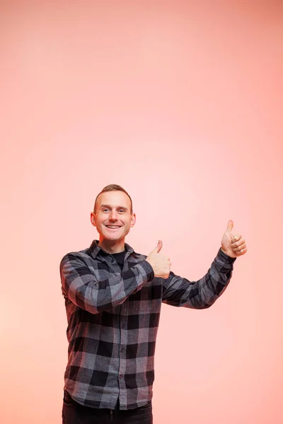 Young Positive Smiling Man Checkered Shirt Pink Background Place Text — Stock Photo, Image