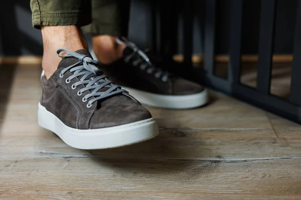 Close Male Legs Pants Gray Casual Sneakers Men Leather Shoes Stock Image
