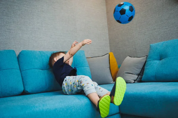 Two Year Old Little Boy Sits Sofa Ball His Hands — Stock Photo, Image