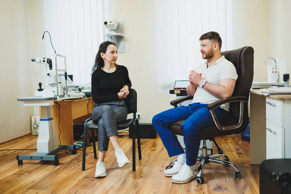 stock image Examination of vision on modern ophthalmological equipment. Eye examination of a woman at an ophthalmologist's appointment using microscopes. Vision treatment at an ophthalmologist appointment