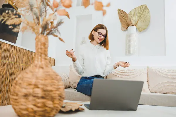 Freelance, work and business at home. A woman works remotely at home on a laptop computer.