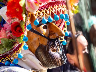 Shignano (Italy) 21/02/2023: The carnival of Schignano parade is one of the most famous traditional carnivals of north Italy with typical wood masks and performer that entertain the visitors .