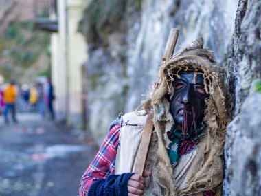 Shignano (Italy) 21/02/2023: The carnival of Schignano parade is one of the most famous traditional carnivals of north Italy with typical wood masks and performer that entertain the visitors .