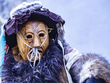 Shignano (Italy) 21/02/2023: The carnival of Schignano parade is one of the most famous traditional carnivals of north Italy with typical wood masks and performer that entertain the visitors .